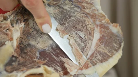 Woman's hands cutting Spanish serrano ham, jamon Stock Footage 147284294