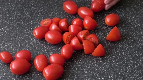 Woman's hands cutting tomato Stock Footage 104233952