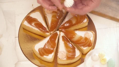 Woman's hands decorating the tarts with the pears Stock Footage 74474305