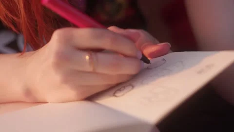 Woman's hands draw with a pencil on paper close up. Novice artist draws sketches Stock Footage 150051850