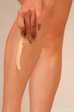 The woman's hands emphasize the elegance and delicacy of the skincare proce.. Stock Photos