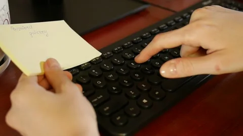 Woman's hands enter "qwerty" computer password Stock Footage 152581576
