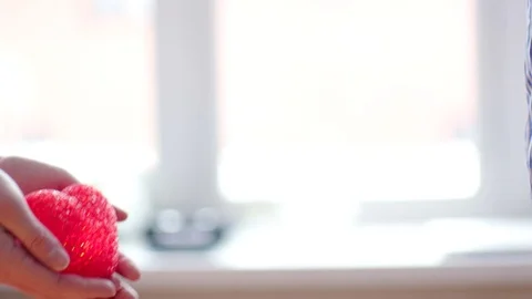Womans hands giving away burning heart to her boyfriend Stock Footage 71632764