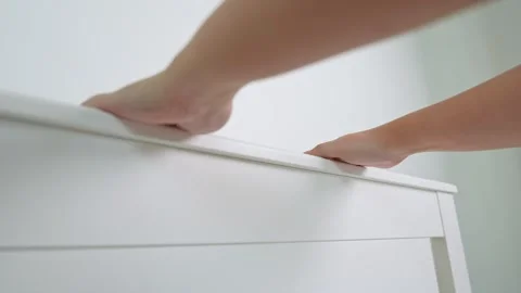 The woman’s hands grasp the bed’s headboard firmly. Video stock 316567962
