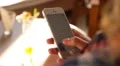 Woman's Hands Hold a Cell Phone while Texting a Message. HD Footage