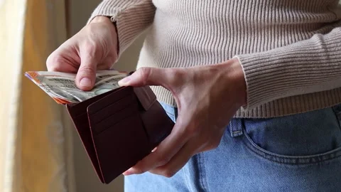 Woman's hands holding leather wallet with indian rupees banknotes. Stock Footage 302103922