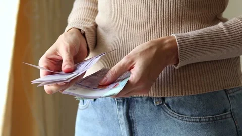 Woman's hands holding Malaysian ringgit MYR cash money banknotes. Stock Footage 303517822