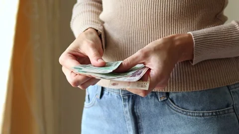 Woman's hands holding Russian rubles (RUB) cash money banknotes. Stock Footage 303518126