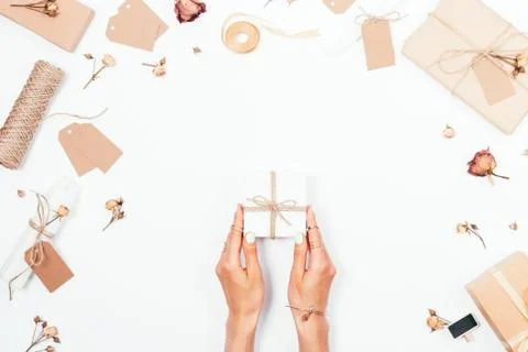 Woman's hands holding small gift box 스톡 사진