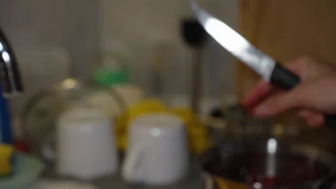 A Woman's Hands In The Kitchen Cut Cherries In Half And Remove The Pits. Stock Footage 277576684