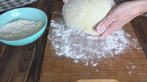 A woman's hands knead the dough. Stock Footage 306283308
