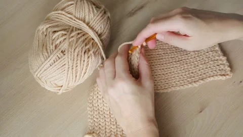 A woman's hands knitting a crochet pattern Stock Footage 289209580