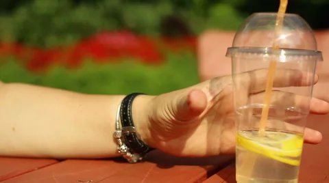 Woman's hands with lemonade Stock Footage 65820674