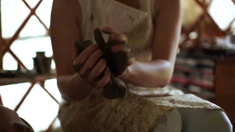 Woman's hands makes a pot on pottery wheel Stock Footage 71521105