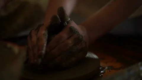 Woman's hands makes a pot on pottery wheel Stock Footage 71521546