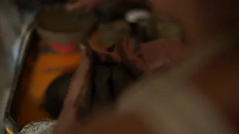 Woman's hands makes a pot on pottery wheel Stock Footage 71521783