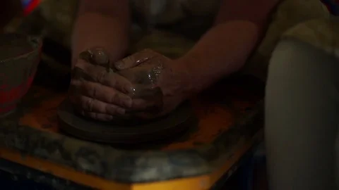 Woman's hands makes a pot on pottery wheel Stock-Footage 71521884