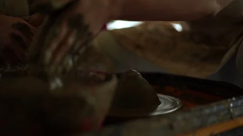 Woman's hands makes a pot on pottery wheel Stock Footage 71521923
