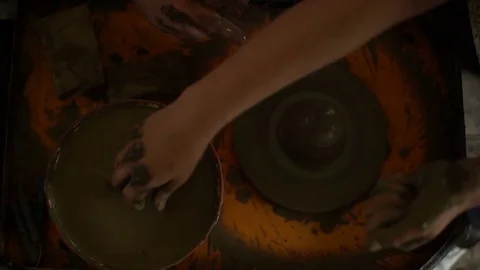 Woman's hands makes a pot on pottery wheel Stock Footage 71522107