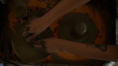 Woman's hands makes a pot on pottery wheel Stock Footage 71522573