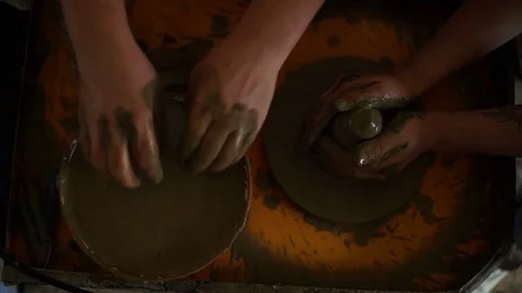 Woman's hands makes a pot on pottery wheel Stock Footage 71522933