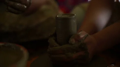 Woman's hands makes a pot on pottery wheel Stock Footage 71523426