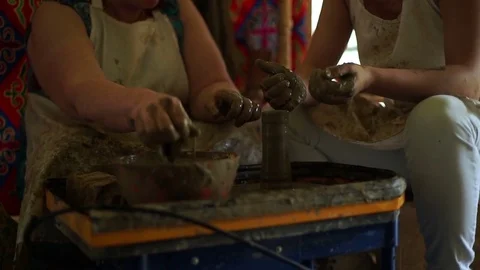 Woman's hands makes a pot on pottery wheel Stock Footage 71523741