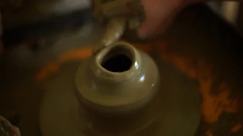 Woman's hands makes a pot on pottery wheel Stock Footage 71525131