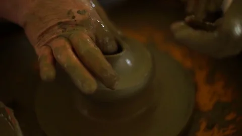 Woman's hands makes a pot on pottery wheel Stock Footage 71525336