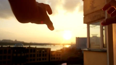 Woman's hands making a heart through the sun at amazing sunset on beautiful Stock-Footage 72233946