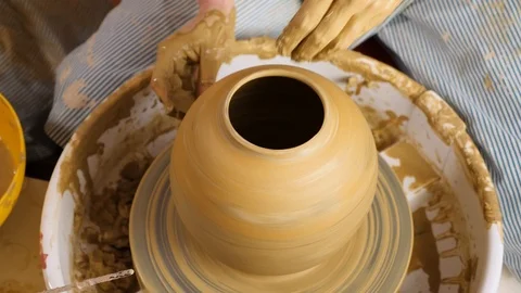 Woman's hands making pot on pottery wheel. Stock Footage 106889099