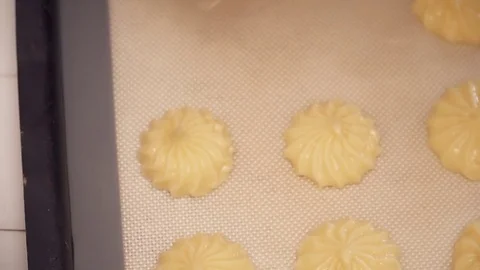 Woman's hands making small eclairs with the help of pastry bag closeup Stock Footage 74467255