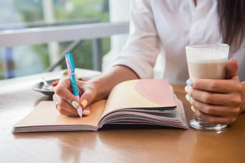 Woman's hands with notebook Stock Photos