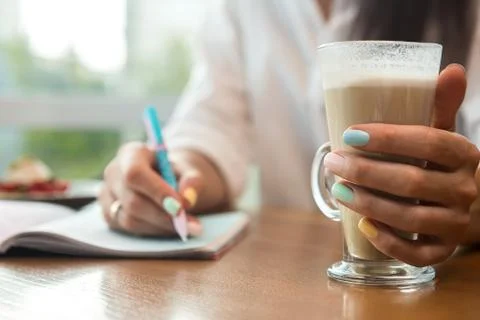 Woman's hands with notebook Stock Photos