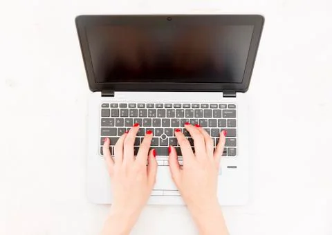 Womans hands on notebook working in clean and bright office, at home, freelan Stock Photos