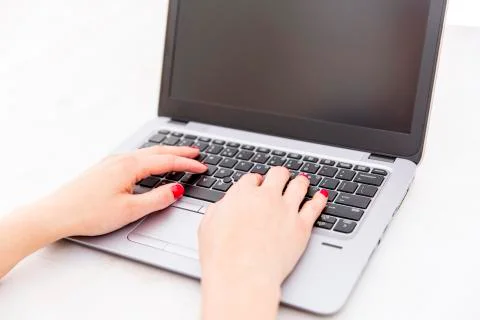 Womans hands on notebook working in clean and bright office, at home, freelan Stock Photos