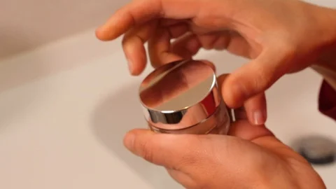 Woman's hands open a jar of white cream Stock Footage 101242436