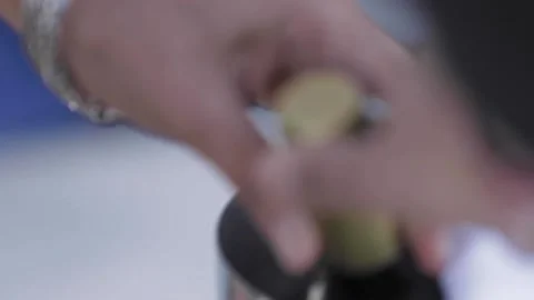 A womans hands opening a champange bottle Video stock 155461402
