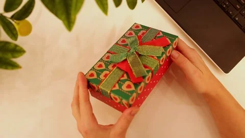 Woman's hands opening giftbox from top view Stock Footage 224344475