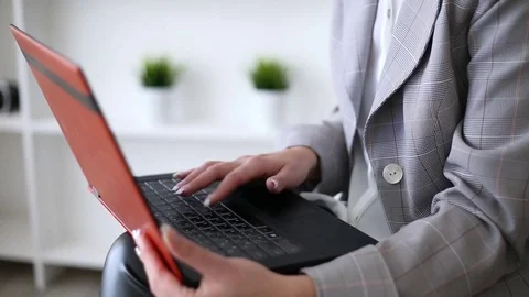 Woman's hands over a laptop Stock Footage 82462732