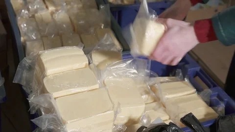 Woman's hands pack cheese Stock Footage 82901139
