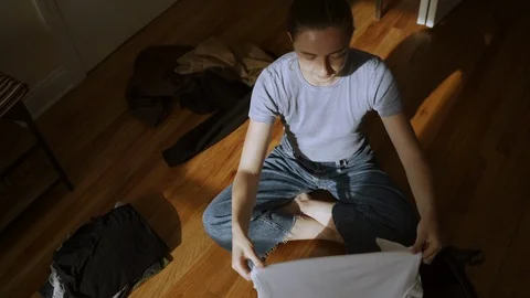 Woman's hands packing a suitcase Video stock 114745199