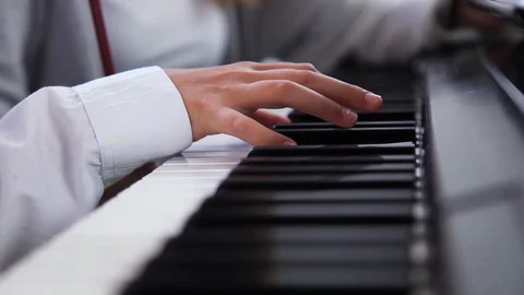 Woman’s hands playing piano. Close-up of black and white keyboard. Piano Stock-Footage 100127331