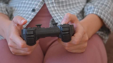 Woman's hands playing video games with controller Stock Footage 328591655