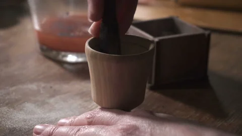 Woman's hands pound some substance in the mortar with pestle Stock Footage 89675286