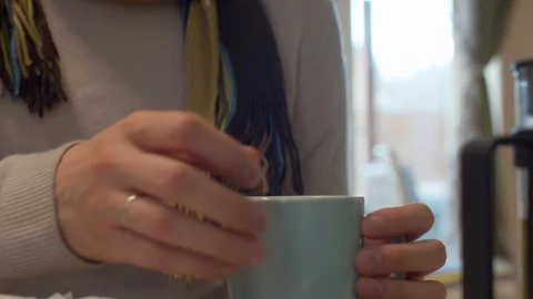 Woman's hands pouring tea into the cup Stock Footage 128698841