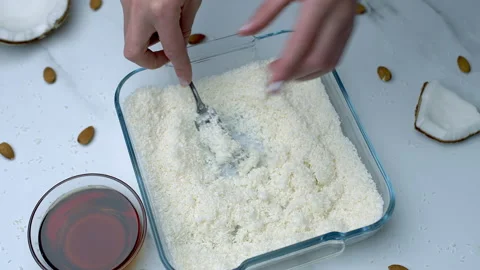 Woman's hands preparing coconut chocolate bowls in 4K Stock Footage 138255023