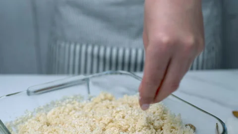 Woman's hands preparing coconut chocolate bowls in 4K Stock Footage 138255059