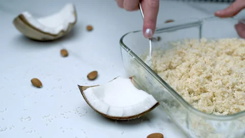 Woman's hands preparing coconut chocolate bowls in 4K Stock Footage 138255584
