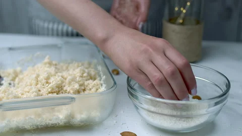 Woman's hands preparing coconut chocolate bowls in 4K Stock Footage 138256254